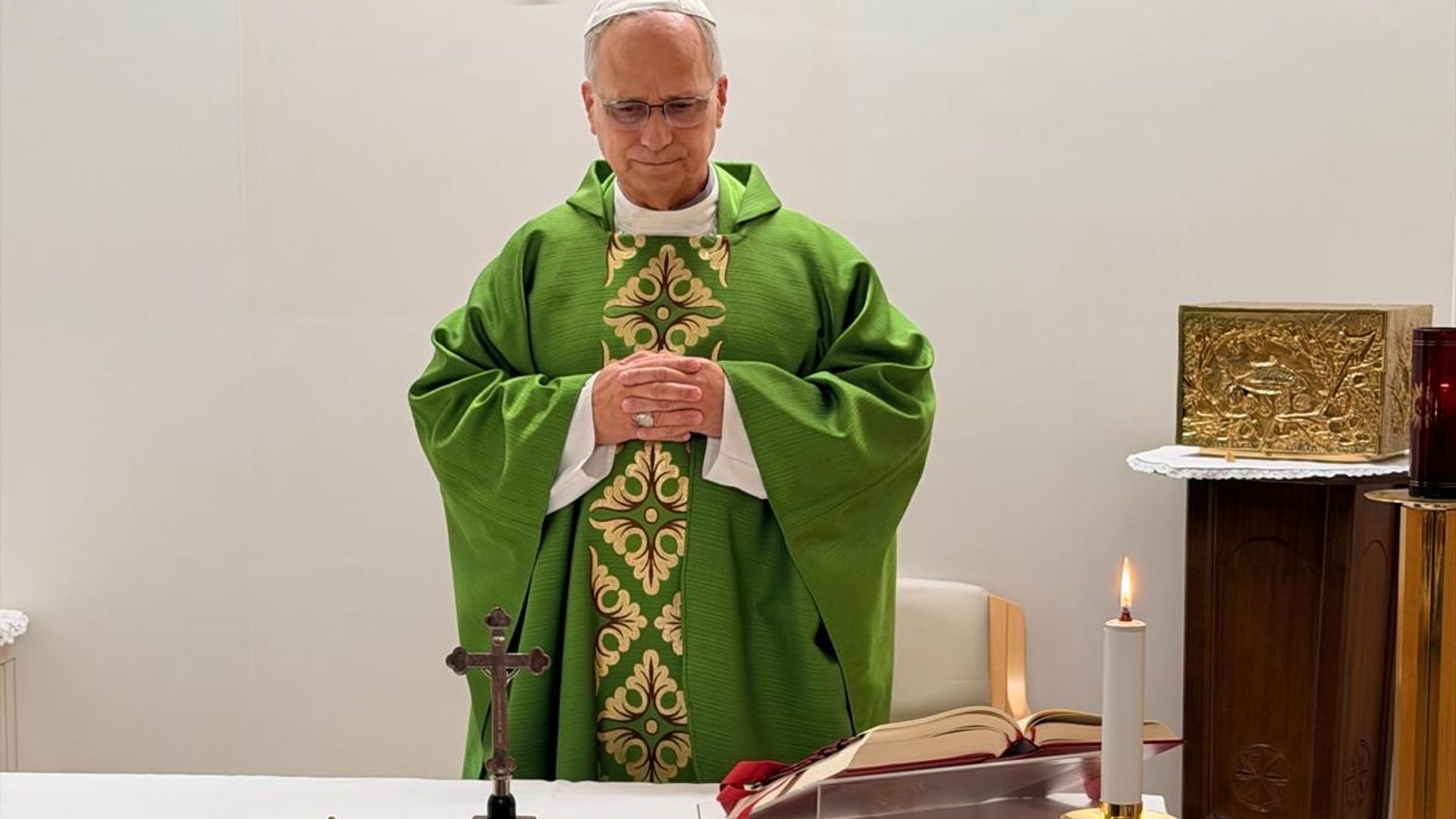 Hospital chapel with candles and a papal mitre, symbolising Pope Francis' recovery after surgery